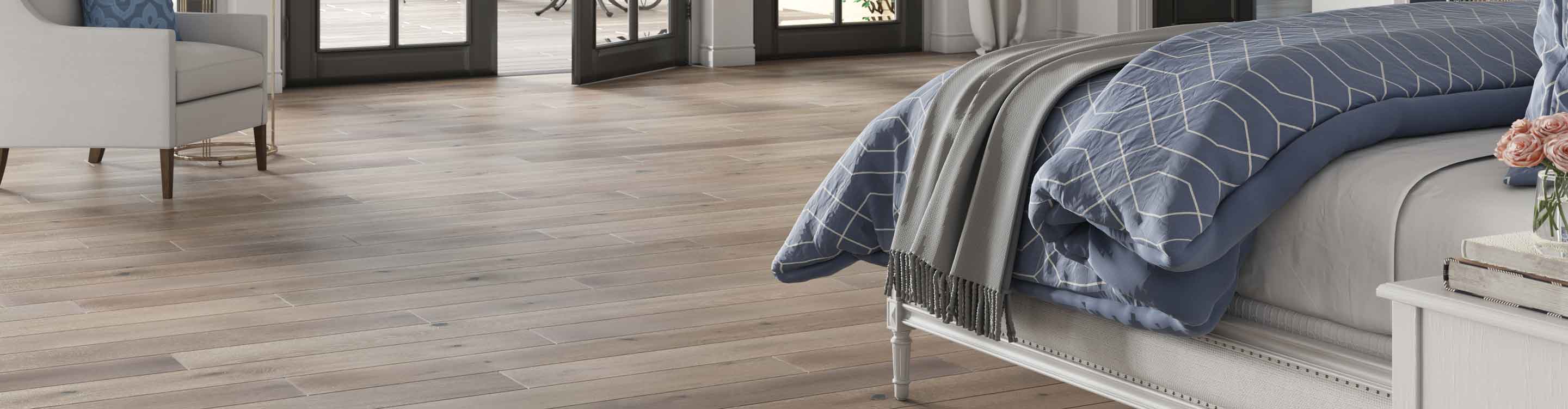 Hardwood flooring in a bedroom with a fireplace