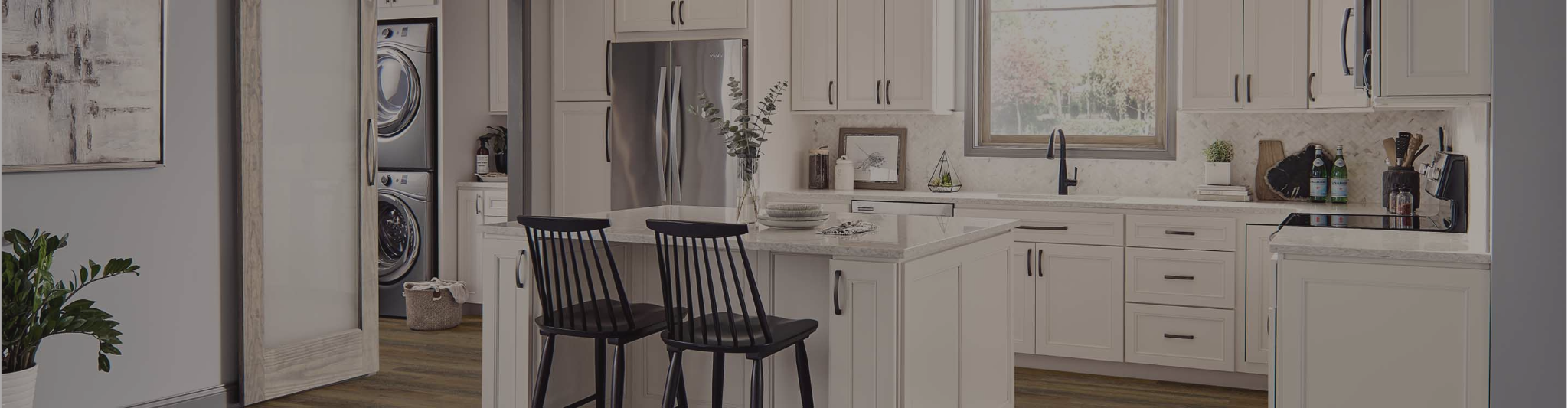 White cabinets in a kitchen with wood-look flooring